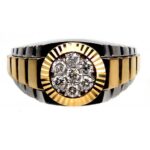 Two-tone gold and black ring with a cluster of diamonds in a circular center setting.
