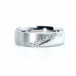 Silver ring with a diagonal line of diamonds on a brushed band