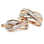 Two rose‑gold interwoven rings with diamond-studded bands.